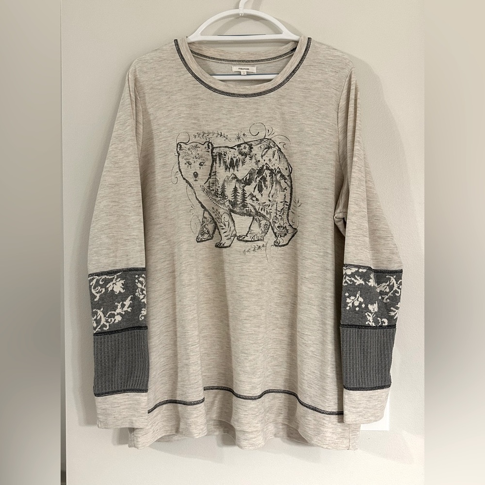 Maurice’s long sleeve with Polar Bear graphic and woven sleeve detail.